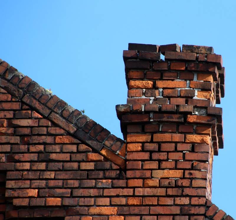 Signs Your Woodstock Home Needs a Chimney Inspection Damaged chimney on an Woodstock home showing cracks and missing mortar